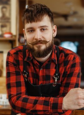 5barber-with-razor-poses-at-the-chair-barbershop-RK6DTSD-2.jpg