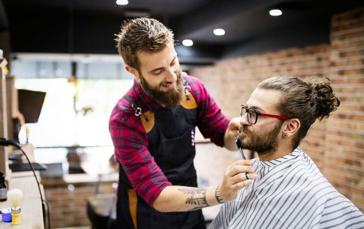 barber-shaving-a-bearded-man-in-a-barber-shop-clo-2021-08-28-09-19-00-utc-2.jpg