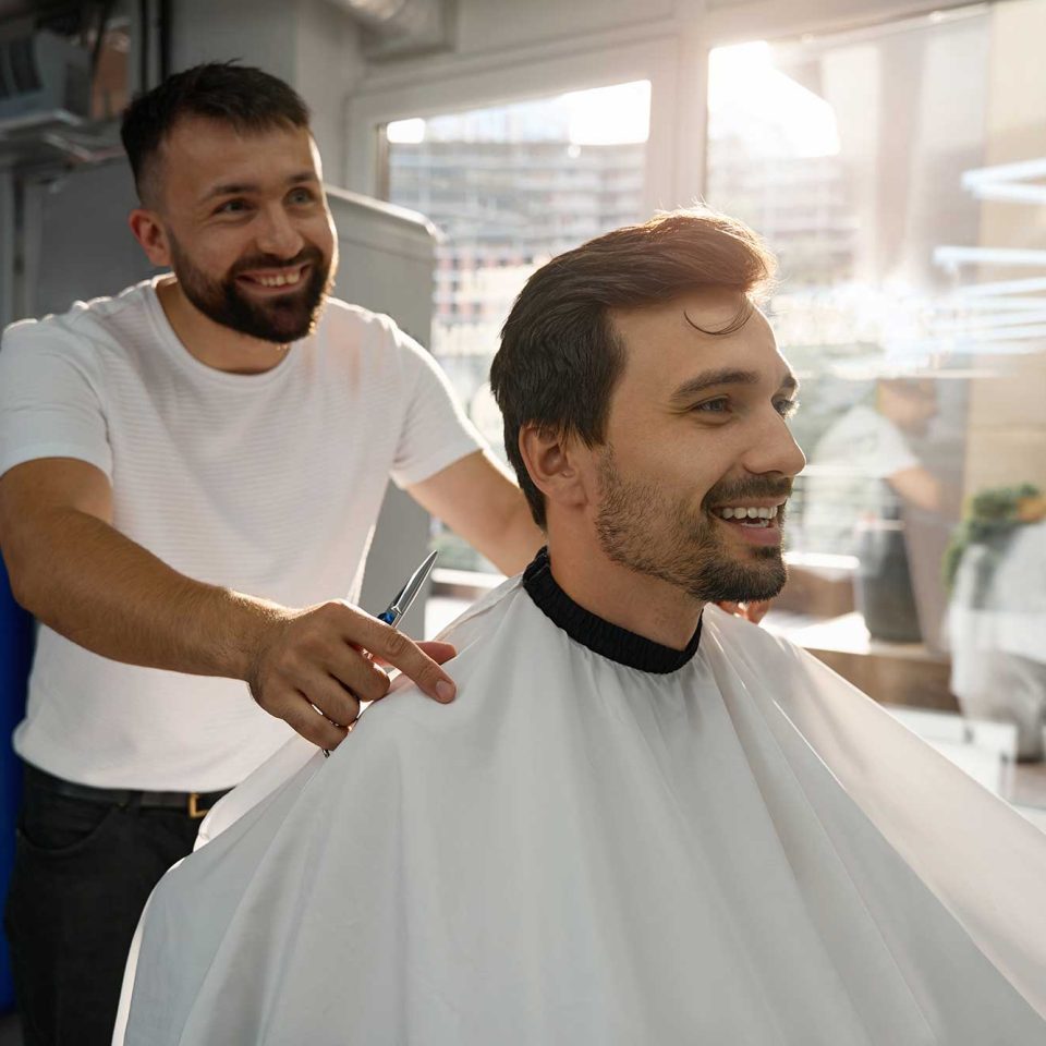 happy-male-client-of-hair-salon-looking-contented-2022-09-28-23-13-57-utc-2.jpg