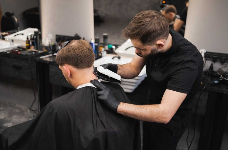 male-hairdresser-making-a-haircut-for-a-young-man-2022-02-17-20-02-40-utc-2.jpg