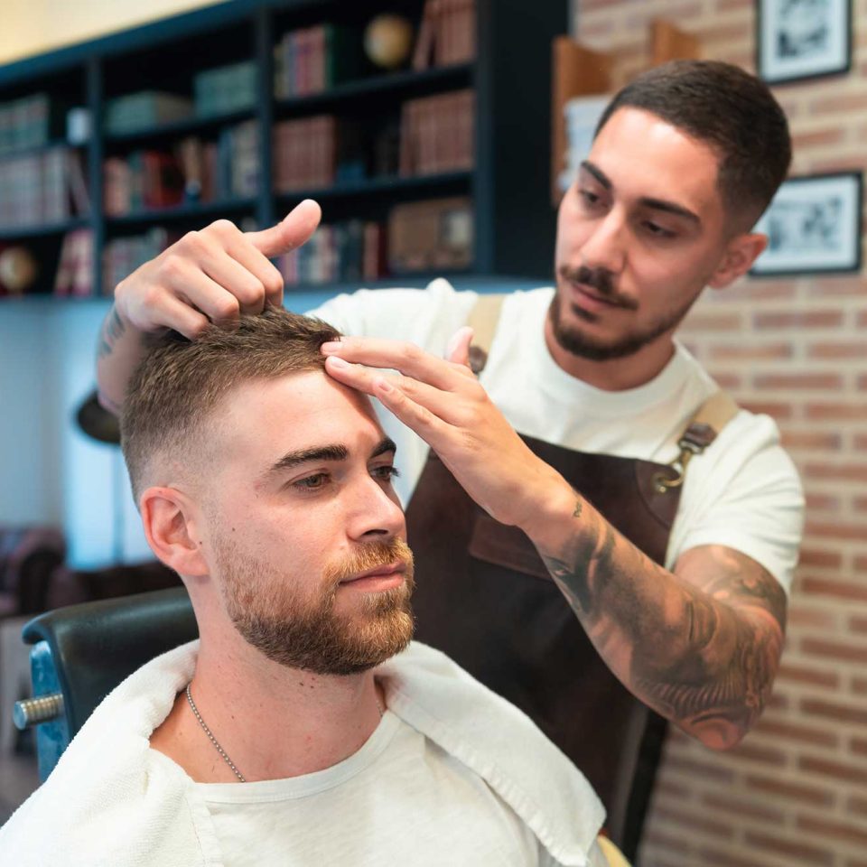 young-hairdresser-with-tattoos-styling-the-male-cu-2023-01-18-19-36-34-utc-2.jpg